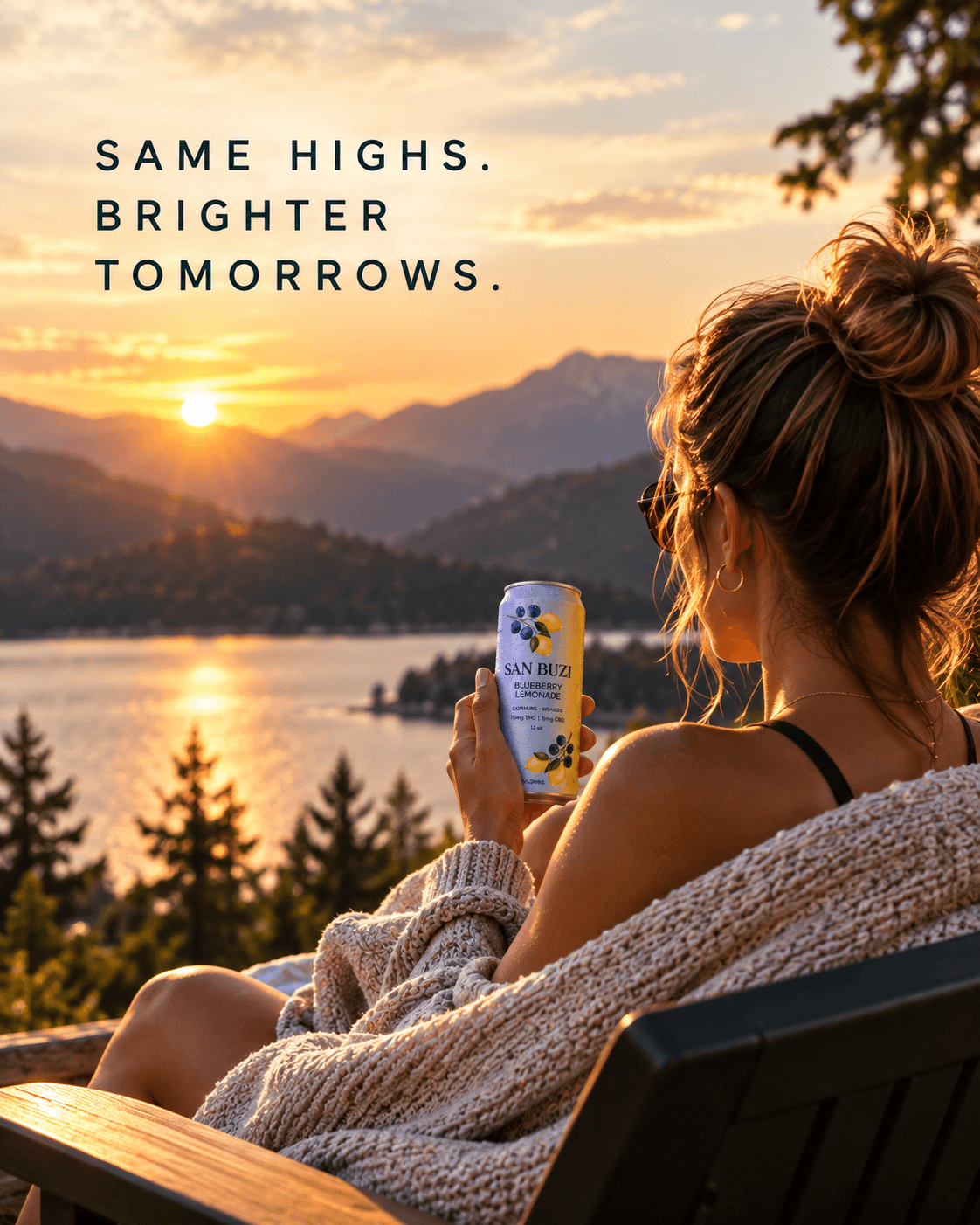 Woman holding a San Buzi Blueberry Lemonade overlooking a lake at sunset