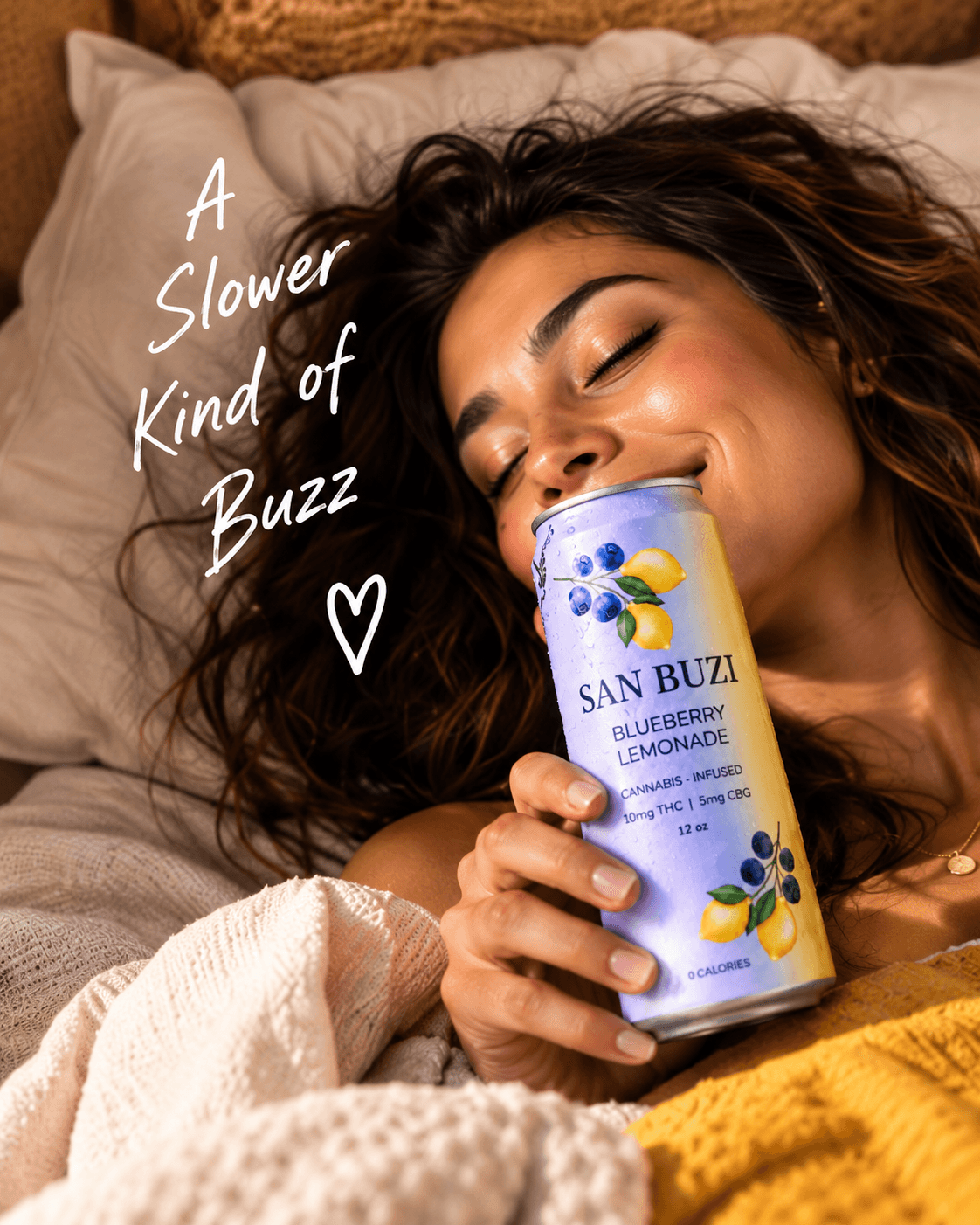 Woman relaxing in bed with a San Buzi Blueberry Lemonade