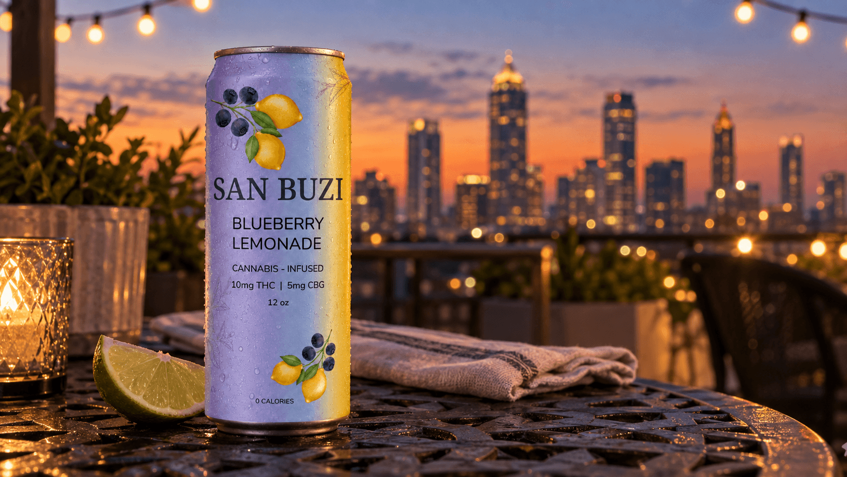 A can of San Buzi Blueberry Lemonade on a rooftop patio table at dusk with the Atlanta skyline in the background